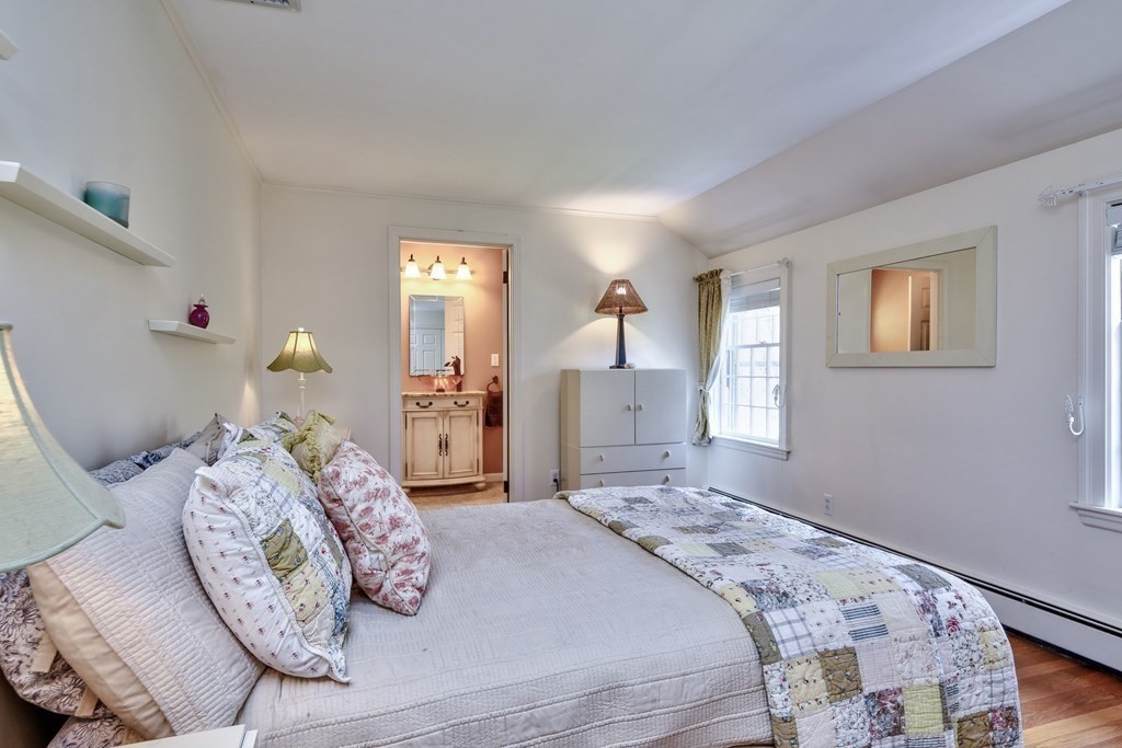 9 Salem Road Wellesley, MA 02481 - Photo 36 of 40 a bedroom with a bed and a mirror