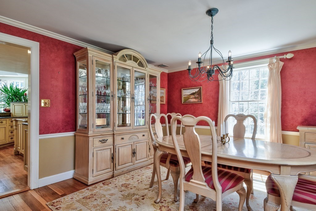 9 Salem Road Wellesley, MA 02481 - Photo 5 of 40 a view of a dining room with furniture and chandelier