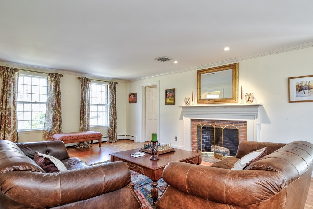 9 Salem Road Wellesley, MA 02481 - Photo 7 of 40 a living room with furniture and a fireplace