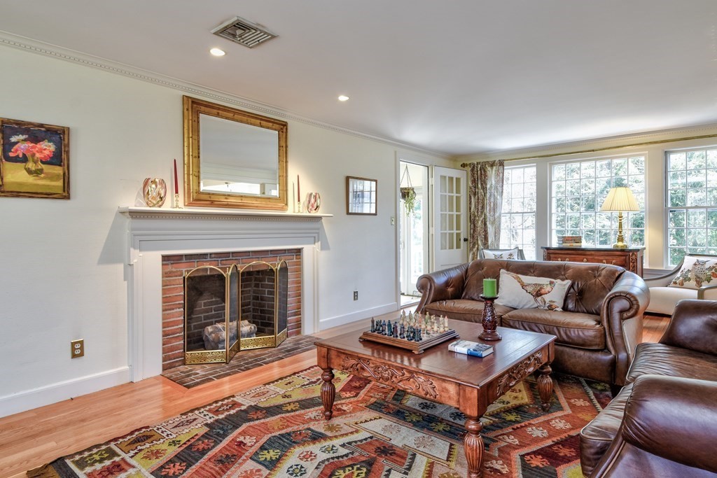 9 Salem Road Wellesley, MA 02481 - Photo 8 of 40 a living room with furniture a window and a fireplace