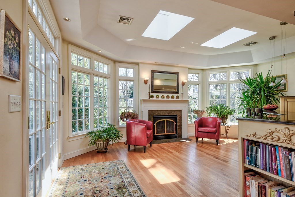 9 Salem Road Wellesley, MA 02481 - Photo 10 of 40 a living room with furniture fireplace and a large window