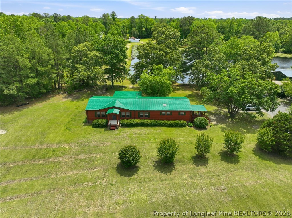 10400 Ruth Vinson Road Autryville, NC 28318 - Photo 12 of 49 a garden view with a lake view