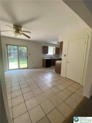 a kitchen with a sink and a stove top oven
