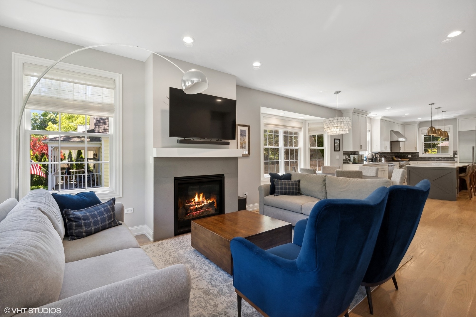 1192 Griffith Road Lake Forest, IL 60045 - Photo 5 of 29 a living room with furniture a fireplace a flat screen tv and windows