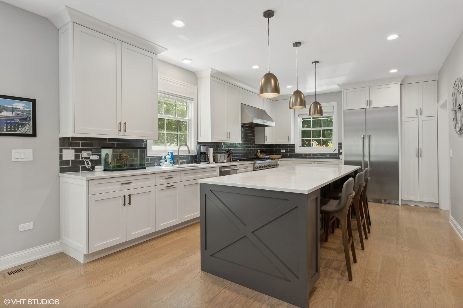 1192 Griffith Road Lake Forest, IL 60045 - Photo 7 of 29 a kitchen with a sink a center island cabinets and a window