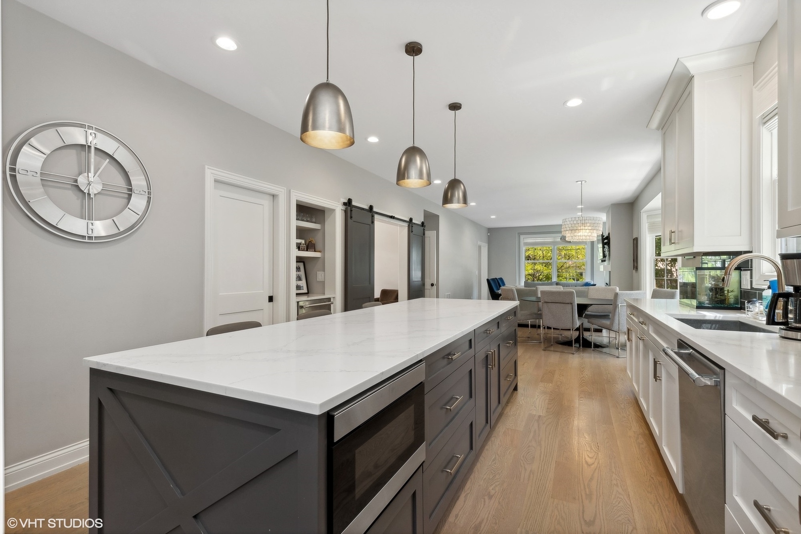 1192 Griffith Road Lake Forest, IL 60045 - Photo 9 of 29 a large kitchen with kitchen island a large counter space a sink appliances and cabinets