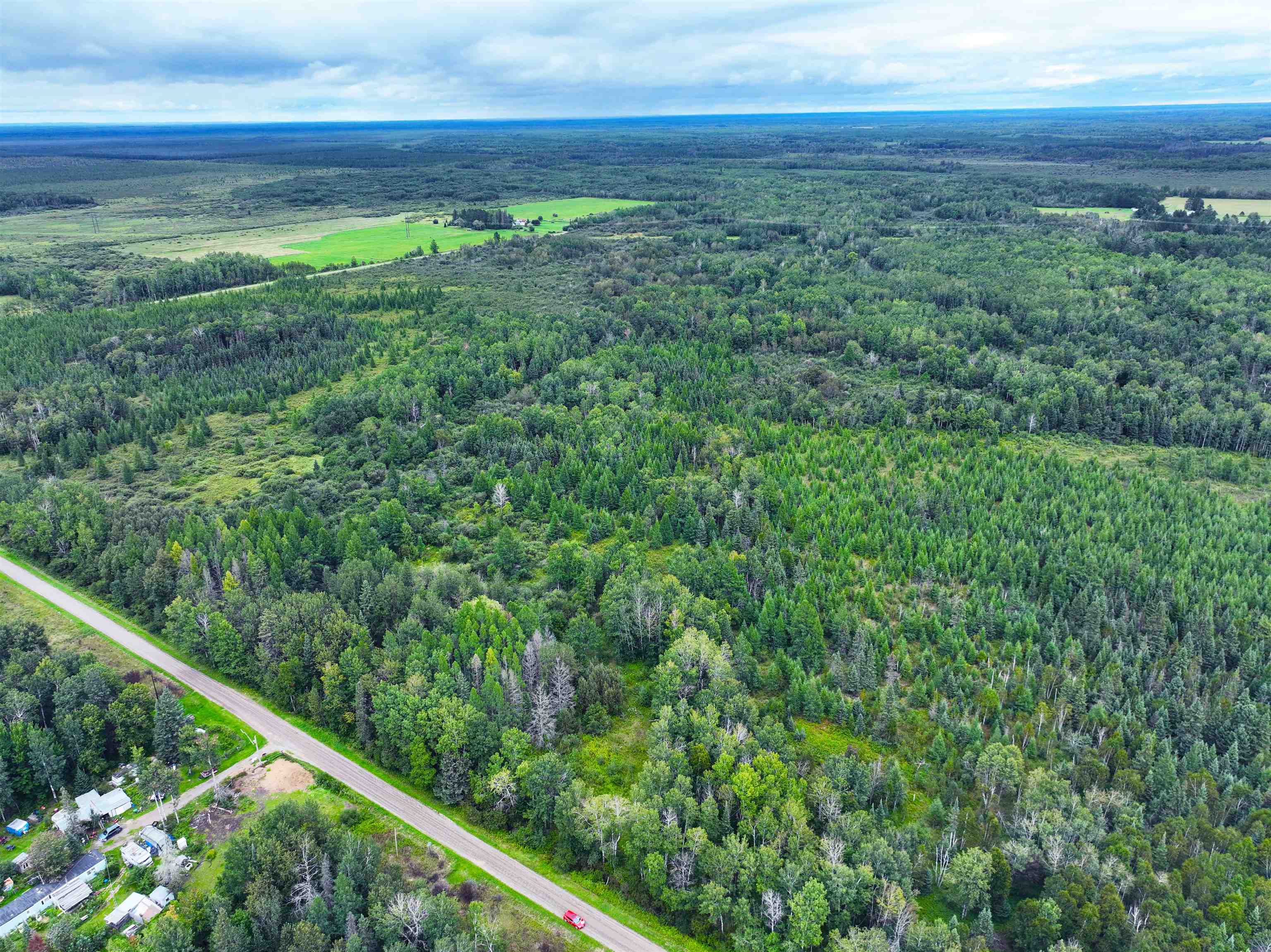 9128 Peary Road Cotton, MN 55724 - Photo 5 of 17 Aerial view of property and surrounding area featuring a forest and property parcel outlined