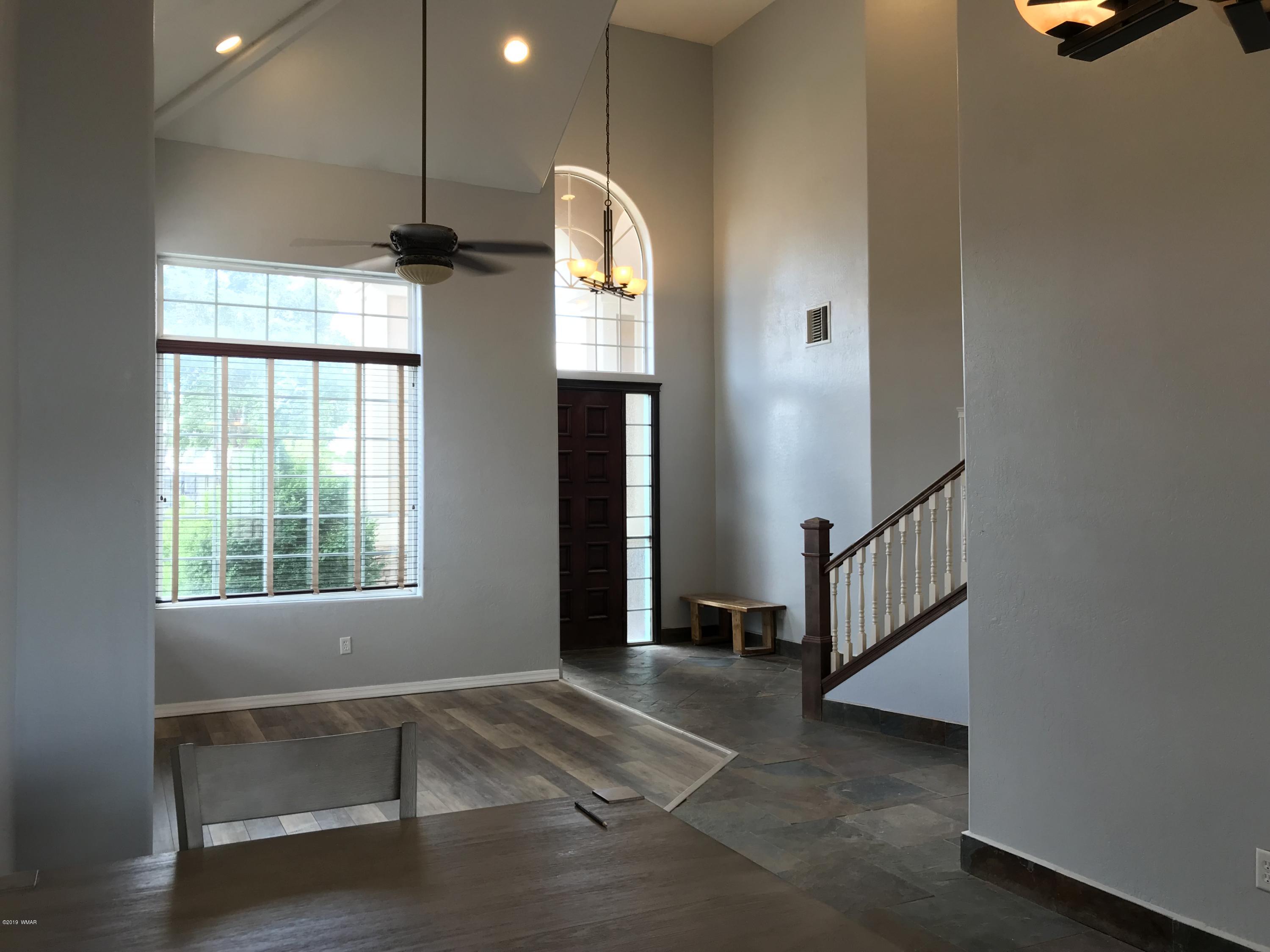 526 South 6th W Street Snowflake, AZ 85937 - Photo 12 of 36 a view of an entryway with wooden floor