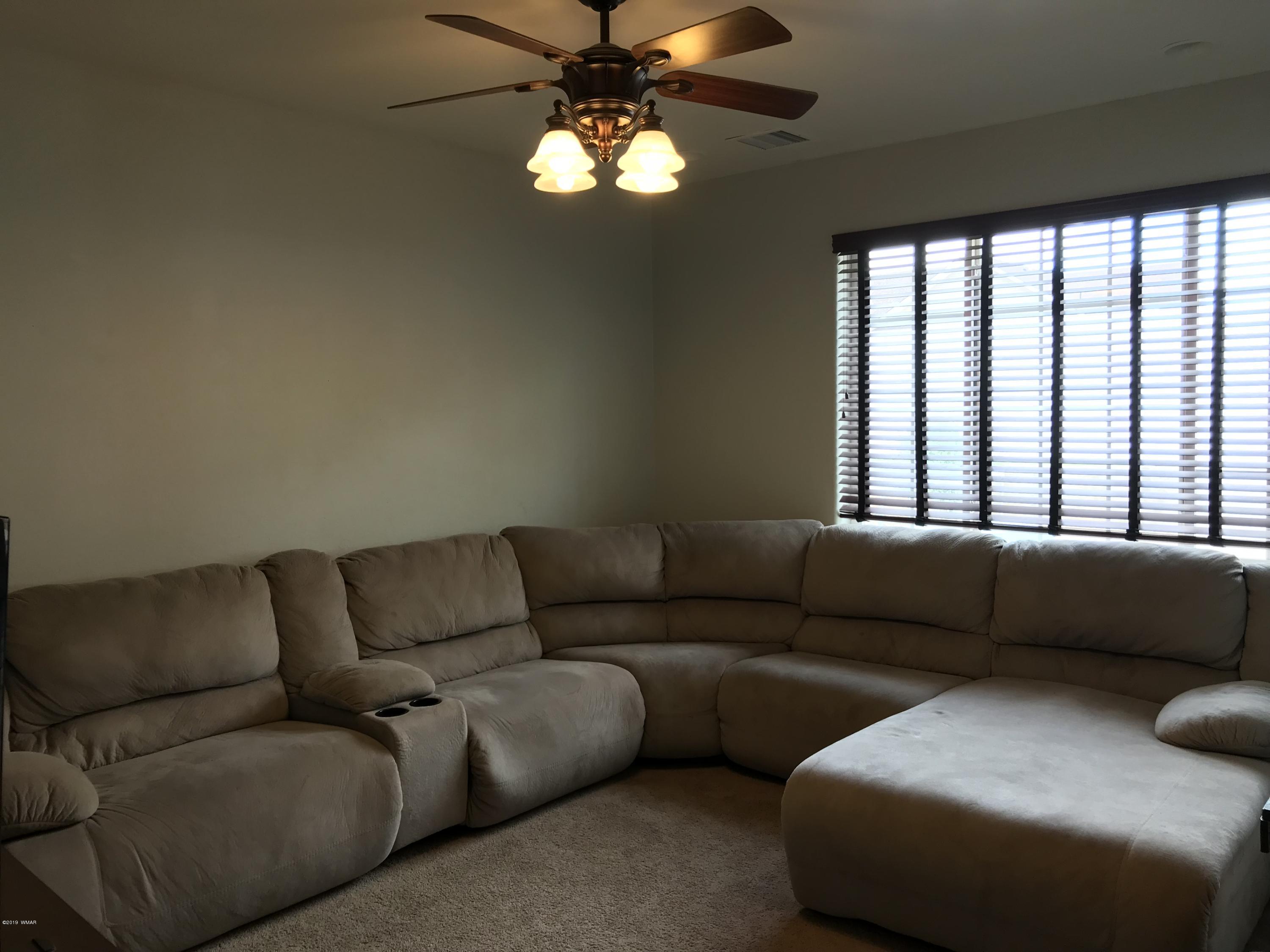 526 South 6th W Street Snowflake, AZ 85937 - Photo 16 of 36 a living room with furniture and a large window