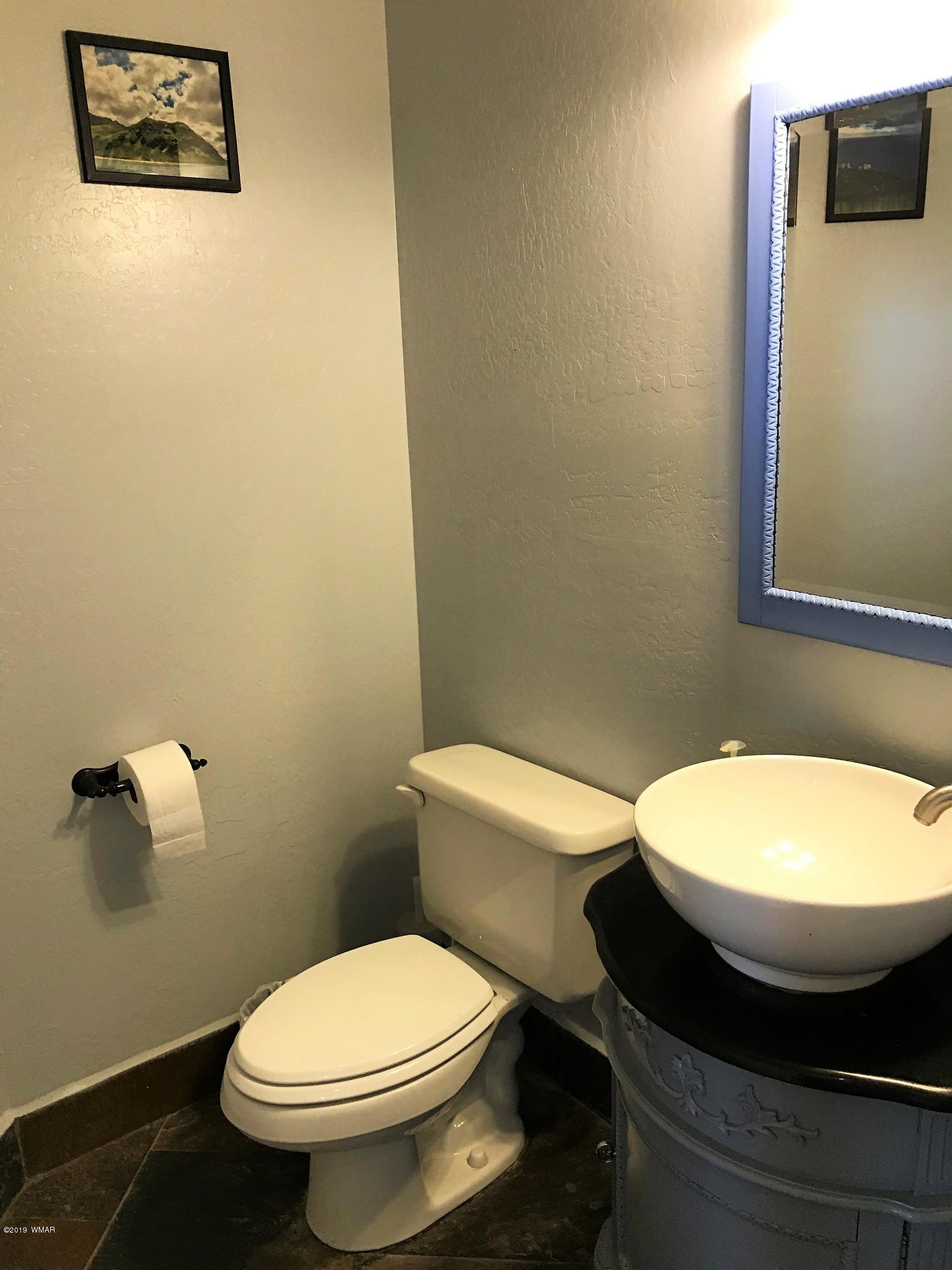 526 South 6th W Street Snowflake, AZ 85937 - Photo 20 of 36 a bathroom with a toilet and a sink