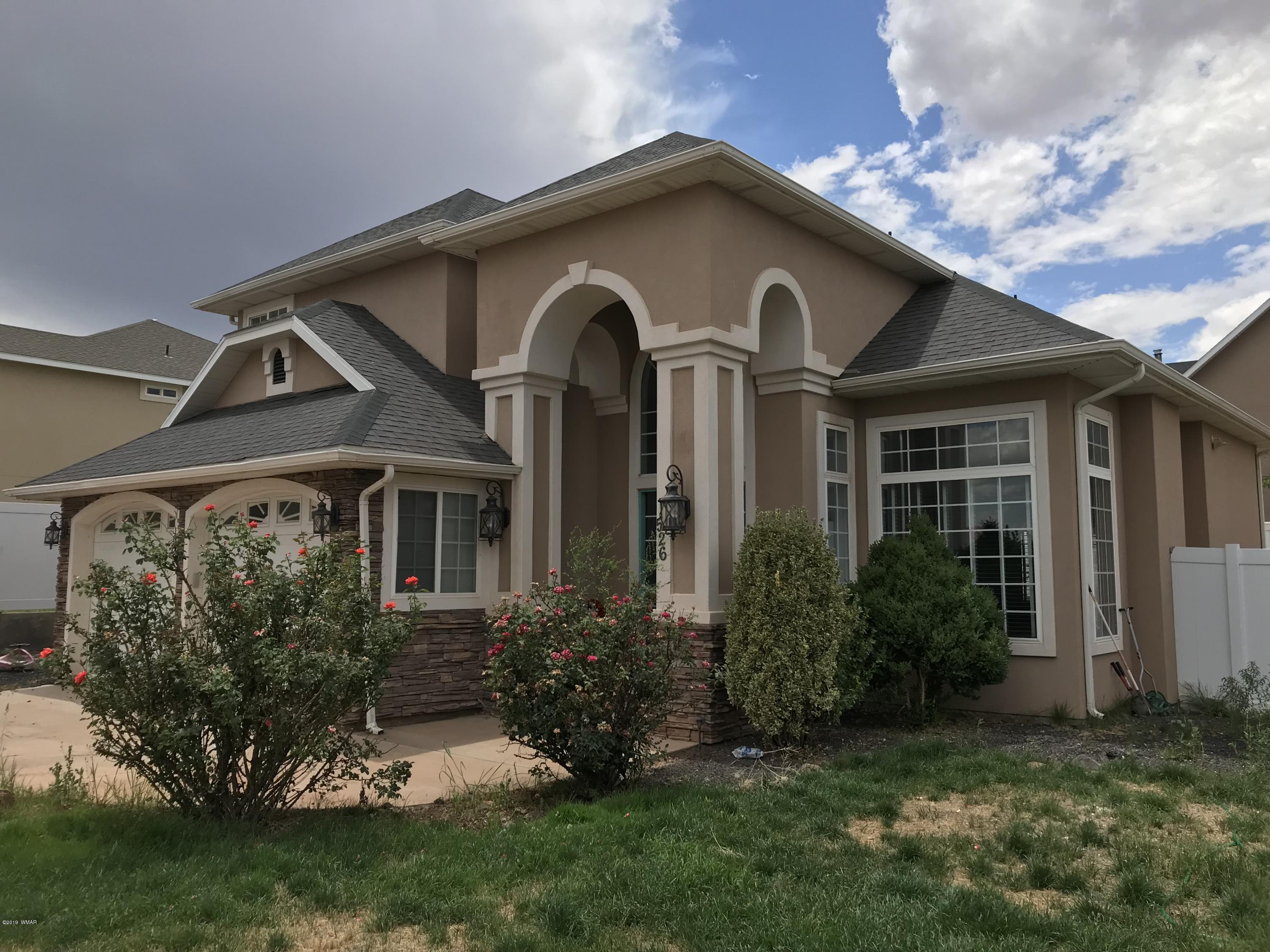 526 South 6th W Street Snowflake, AZ 85937 - Photo 2 of 36 a front view of a house with a yard