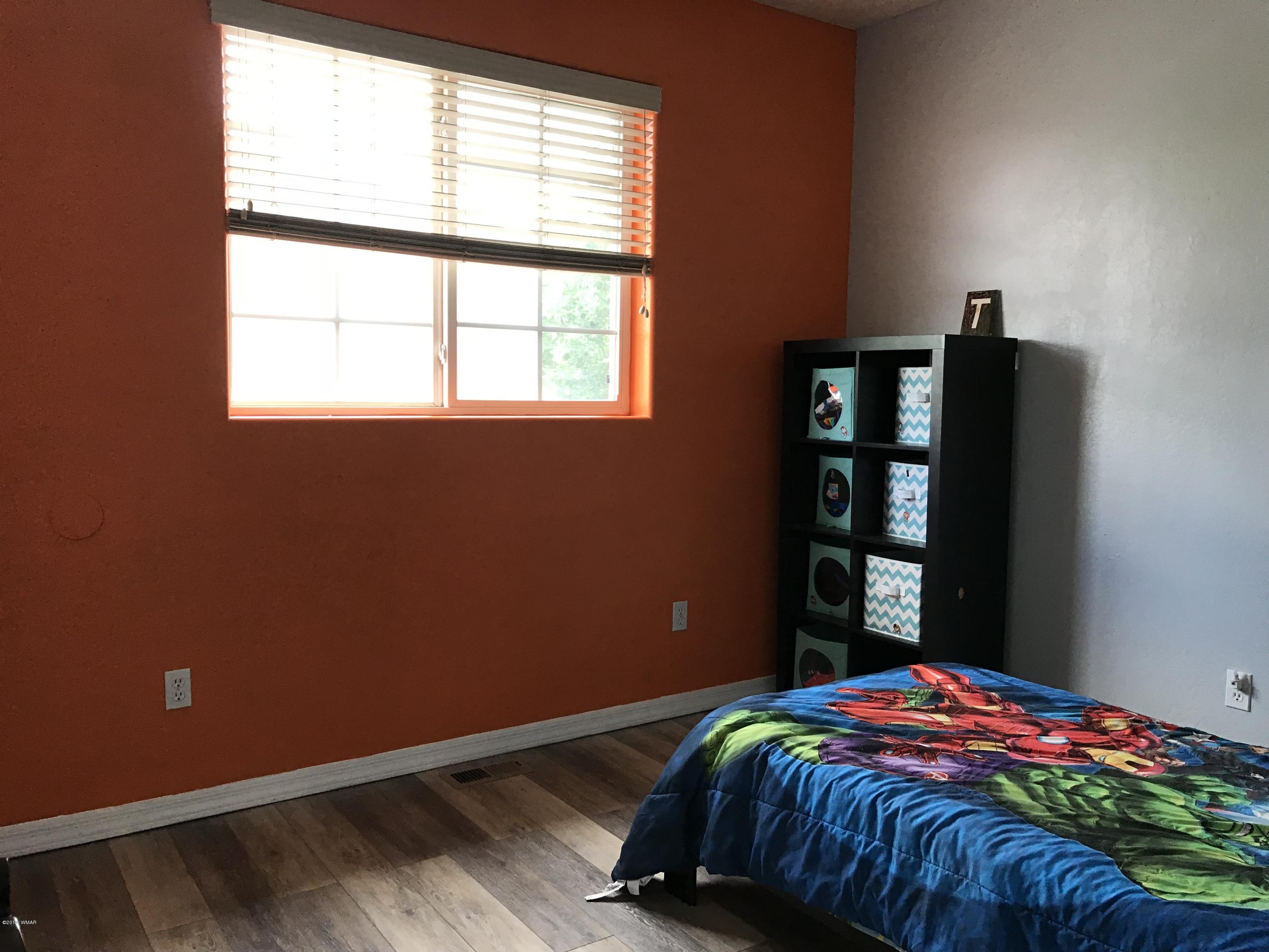 526 South 6th W Street Snowflake, AZ 85937 - Photo 30 of 36 a bedroom with a bed and a window
