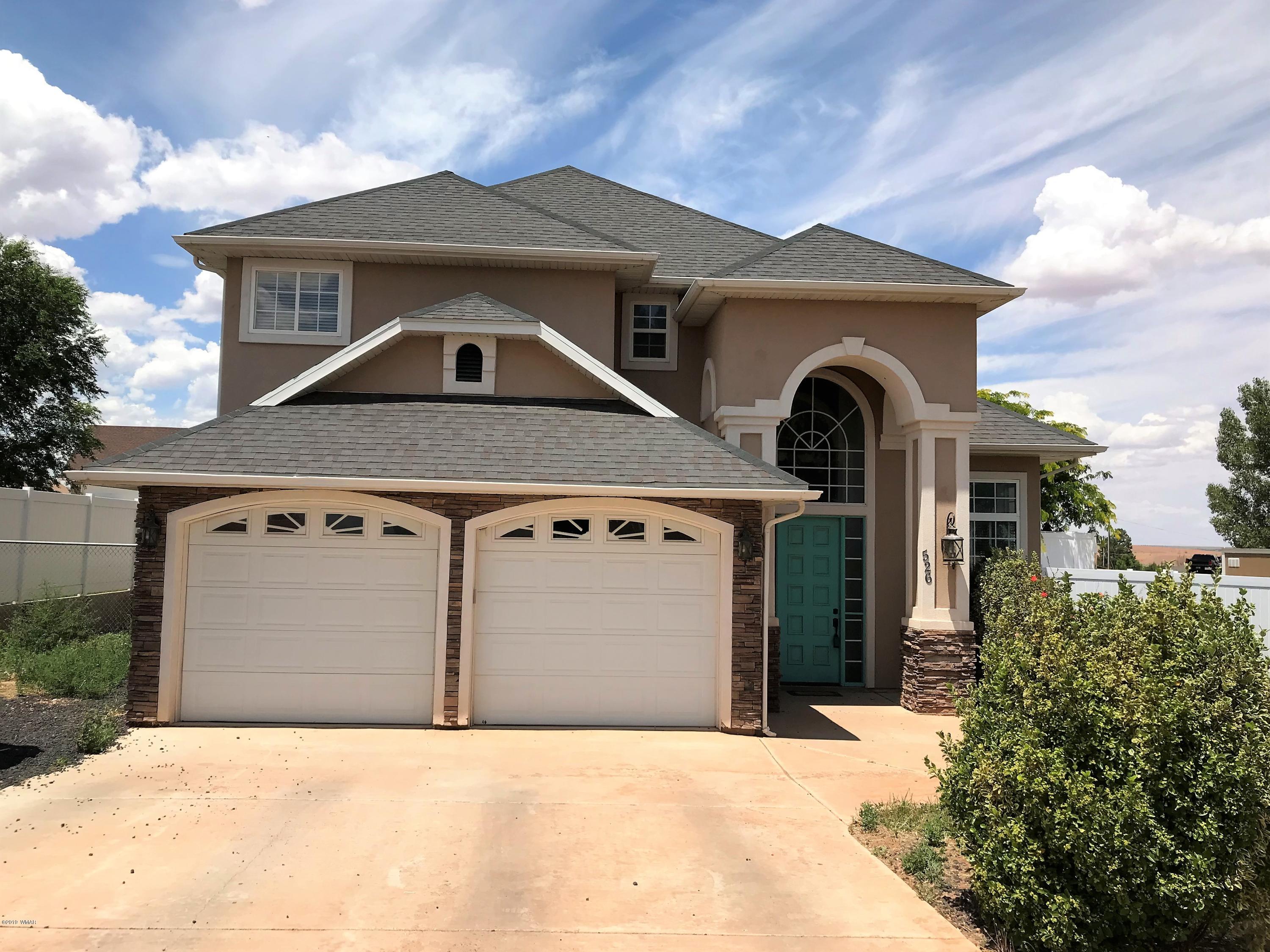 526 South 6th W Street Snowflake, AZ 85937 - Photo 4 of 36 a front view of a house with garage