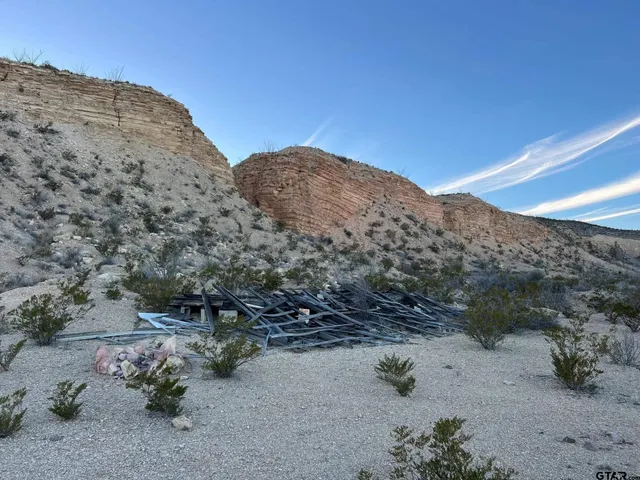 a view of a mountain view with mountains in the background
