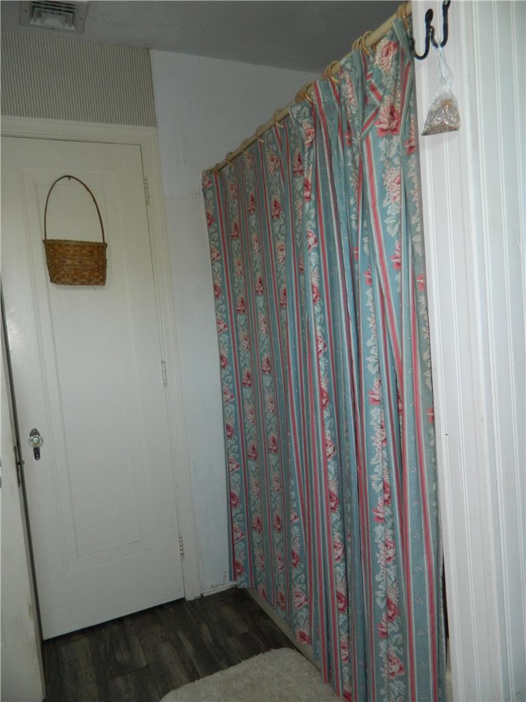 2130 Huntington Street Bethlehem, PA 18017 - Photo 22 of 23 Richly patterned drapery conceals a discrete interior space, complementing the wood-look flooring.