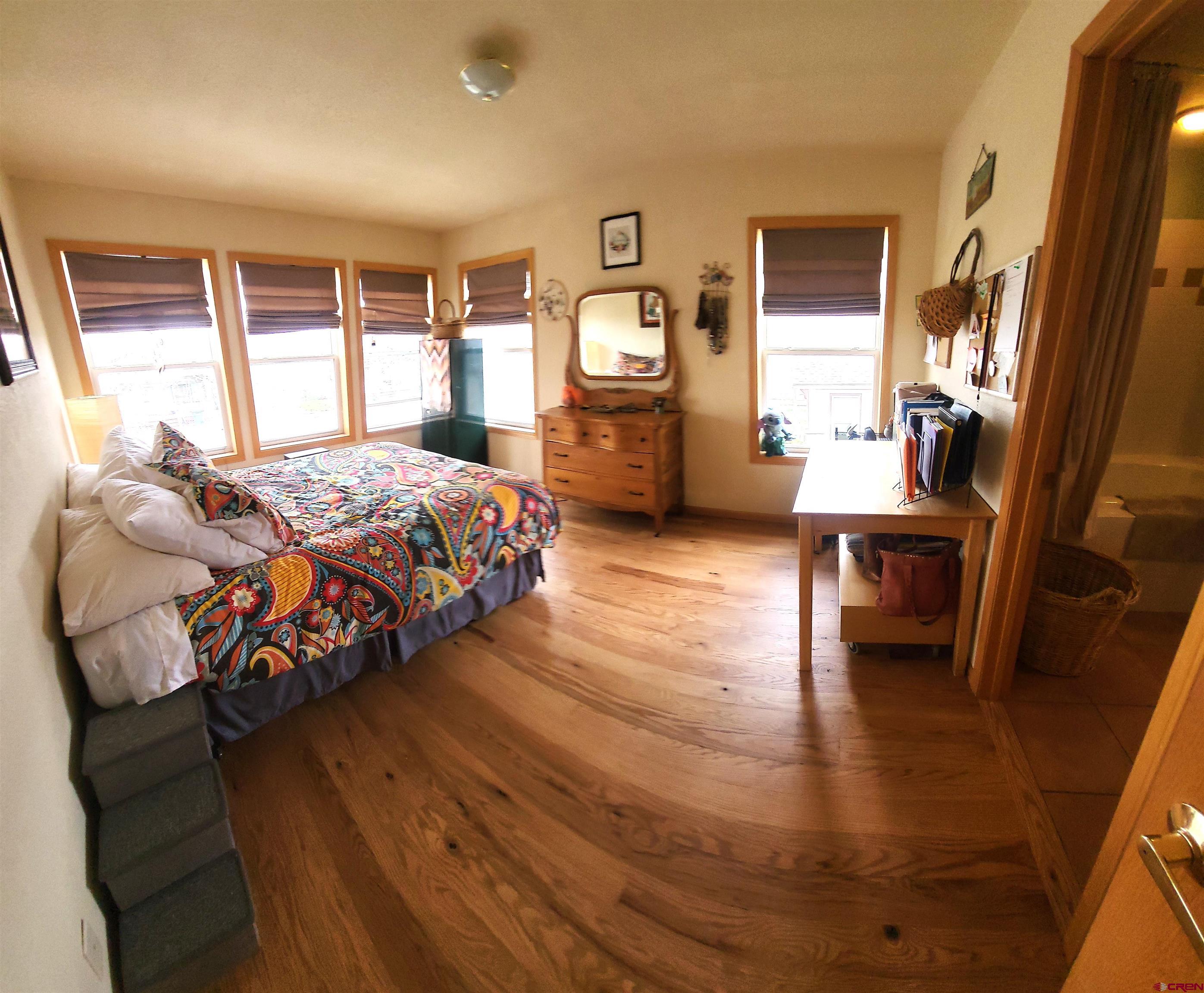 1610 Pine Street, Unit E Norwood, CO 81423 - Photo 14 of 23 a bedroom with furniture and a window