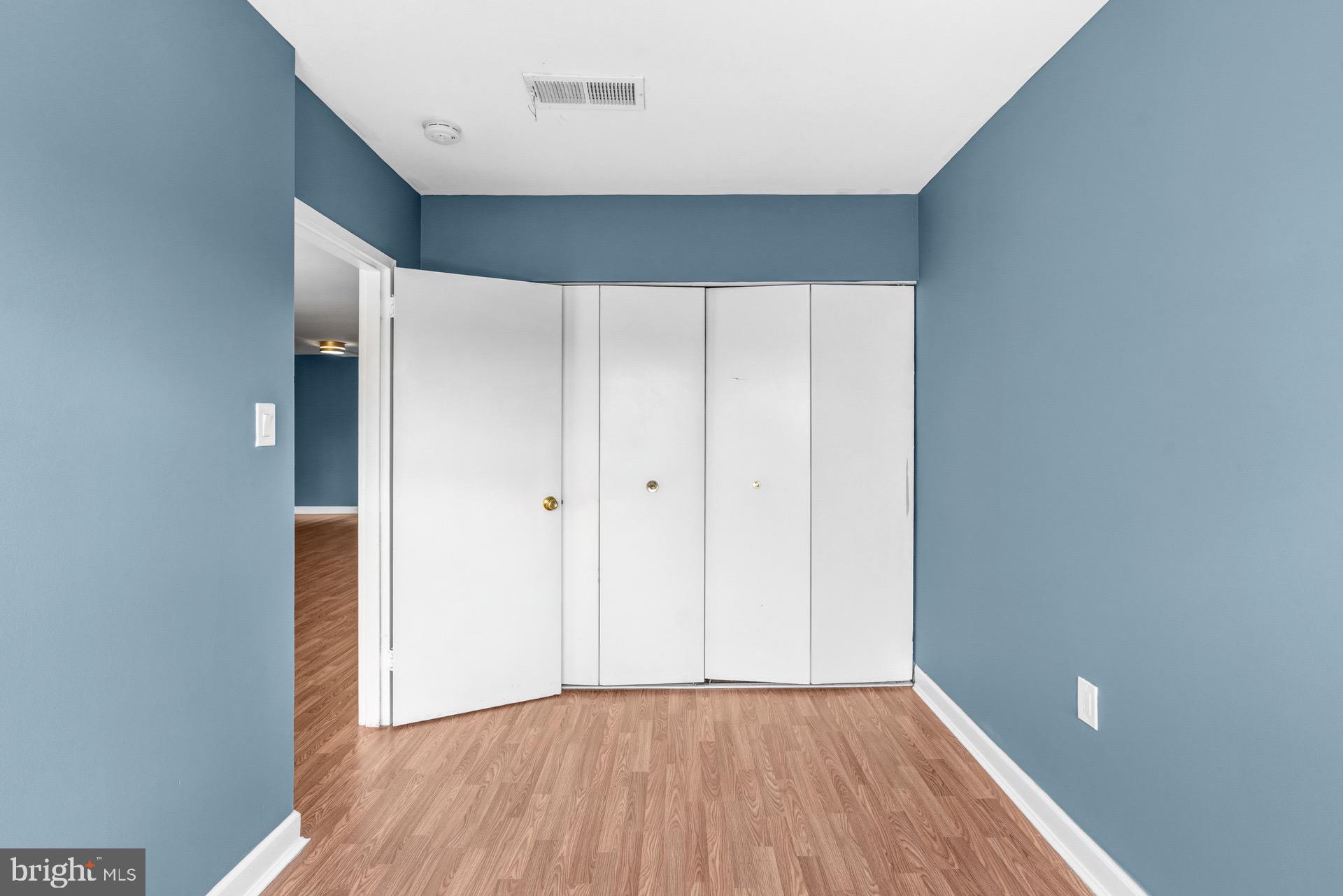 422 Girard Street, Unit 144 Gaithersburg, MD 20877 - Photo 11 of 26 a view of an empty room with wooden floor