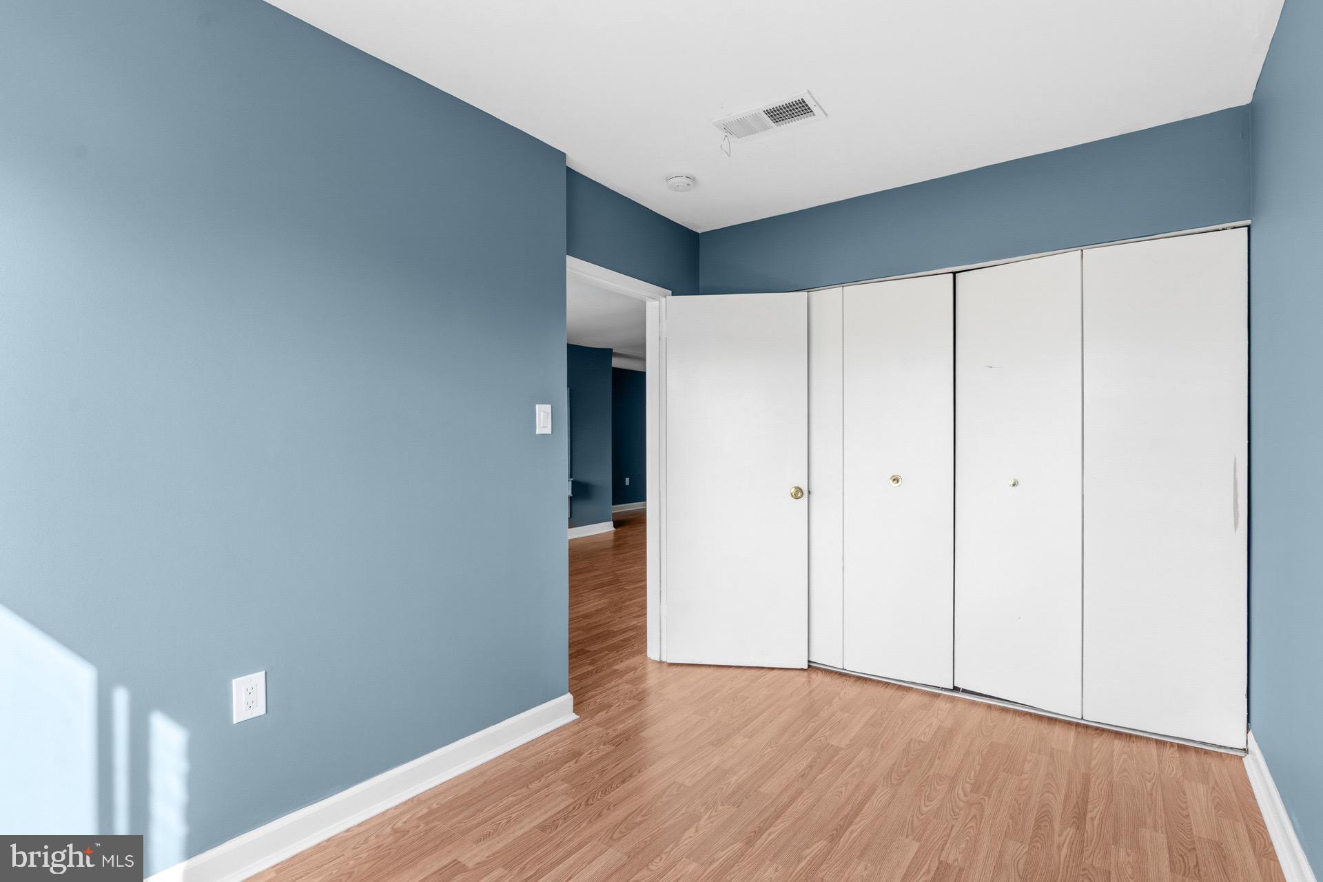 422 Girard Street, Unit 144 Gaithersburg, MD 20877 - Photo 12 of 26 a view of an empty room and wooden floor