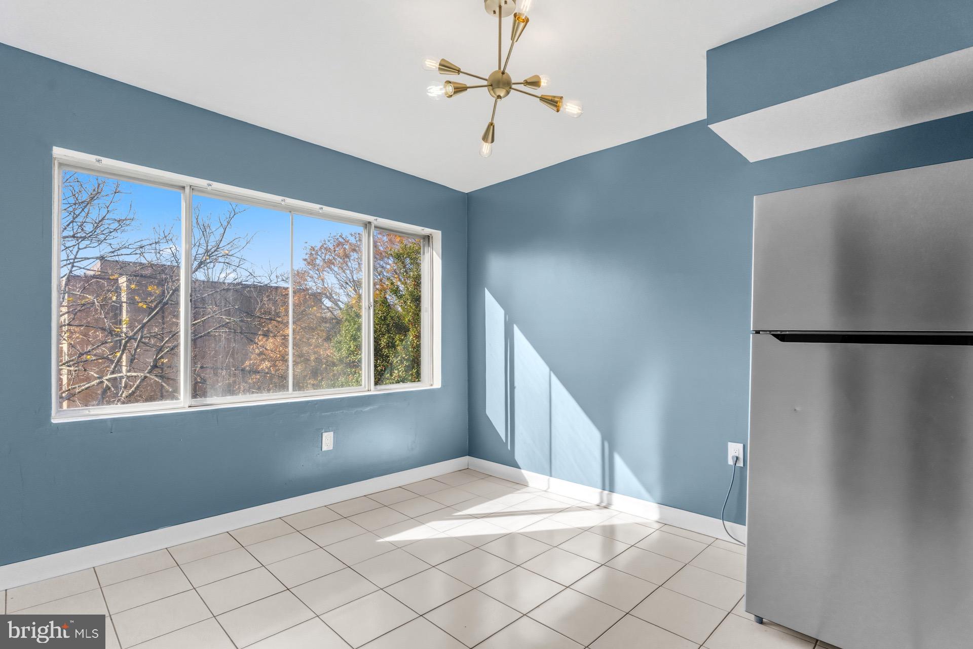 422 Girard Street, Unit 144 Gaithersburg, MD 20877 - Photo 17 of 26 a bedroom with a bed and a window