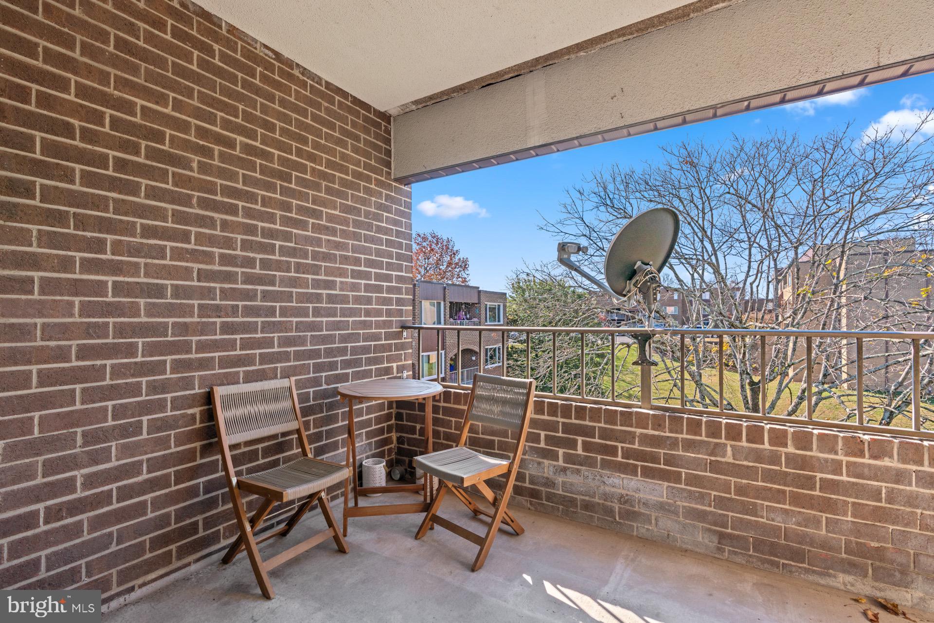422 Girard Street, Unit 144 Gaithersburg, MD 20877 - Photo 25 of 26 a view of a chair and table in the room