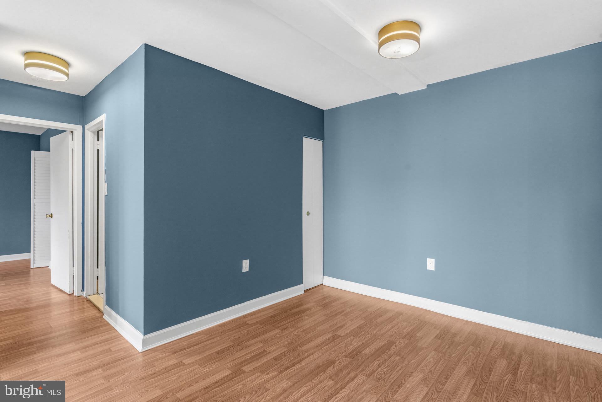 422 Girard Street, Unit 144 Gaithersburg, MD 20877 - Photo 8 of 26 a view of an empty room with wooden floor