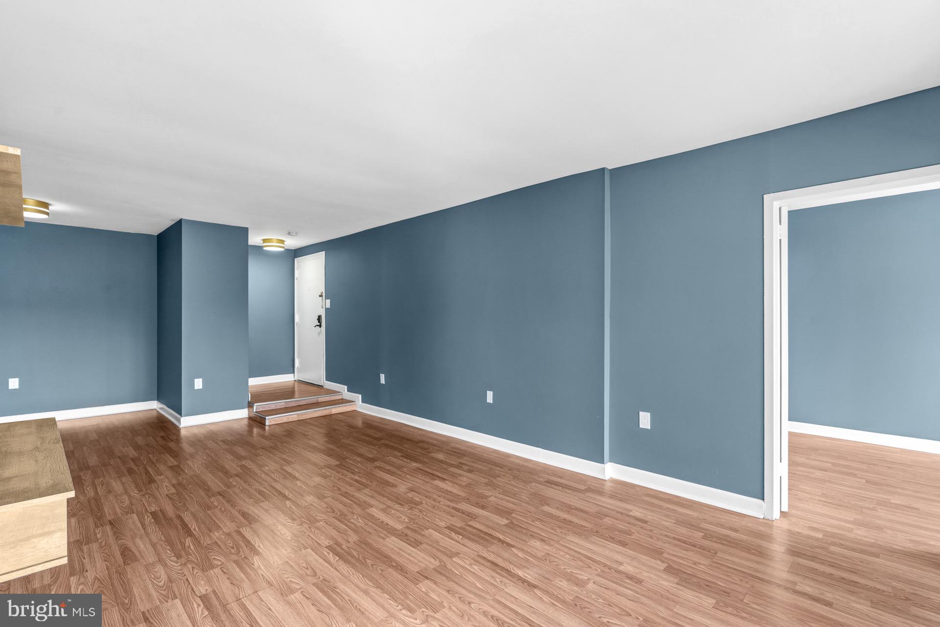 422 Girard Street, Unit 144 Gaithersburg, MD 20877 - Photo 9 of 26 a view of a livingroom with wooden floor