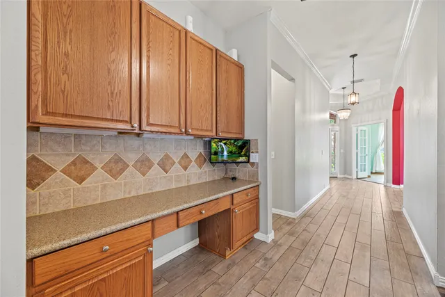 a view of hallway with wooden floor and staircase