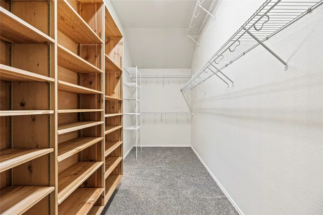a view of an empty walk in closet