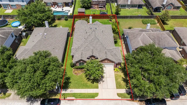 an aerial view of a houses with outdoor space