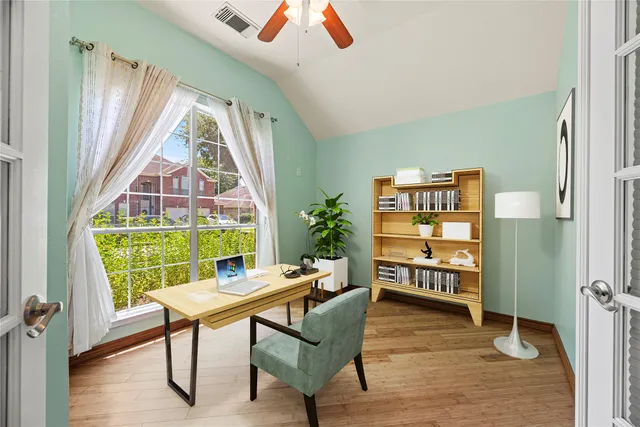 a living room with furniture a rug and a large window
