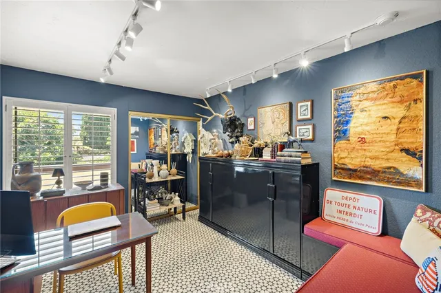 a living room with furniture a rug and a window