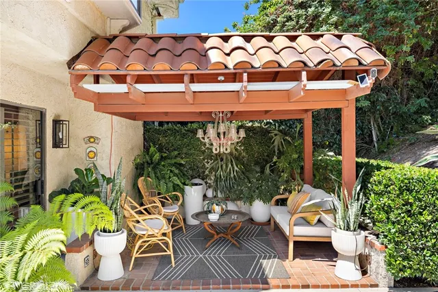 a patio with table and chairs