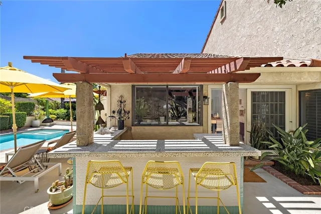 a view of an chairs and table in the patio