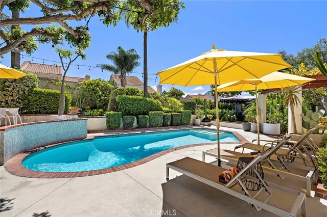 a view of a swimming pool with a patio