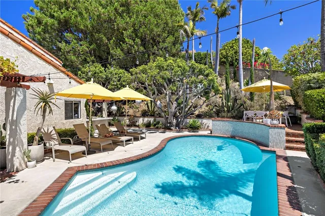a view of a swimming pool with a patio