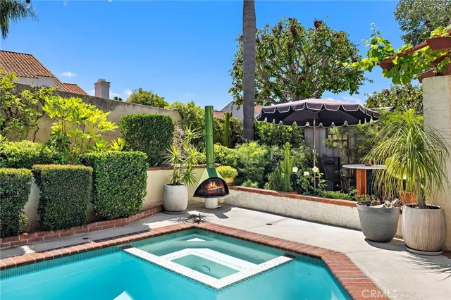 a view of a patio with chairs and plants
