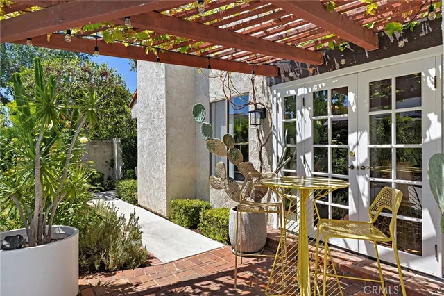 a view of a porch with potted plants