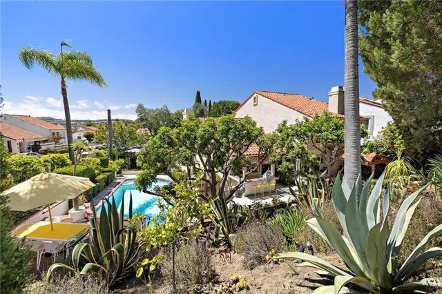 a view of a house with a palm tree