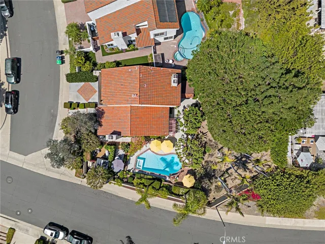 an aerial view of a house with a yard and garden view