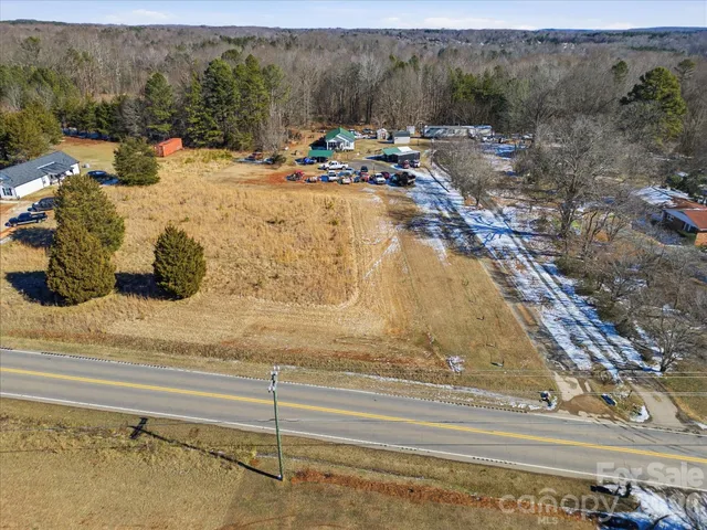 a view of swimming pool with a yard and sitting area