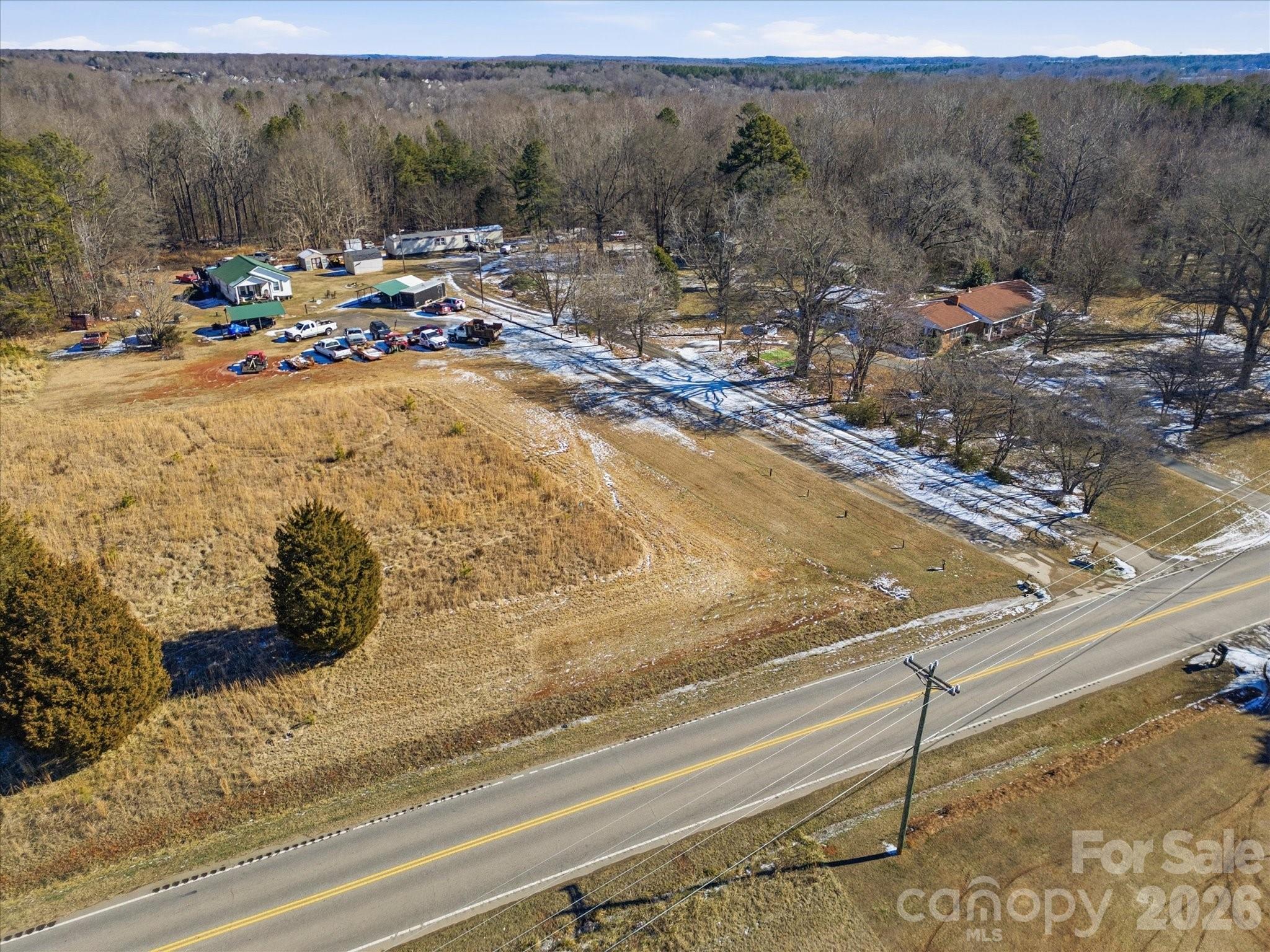 5822 Oakridge Road Clover, SC 29710 - Photo 15 of 29 a view of a backyard of a house with a yard and sitting area
