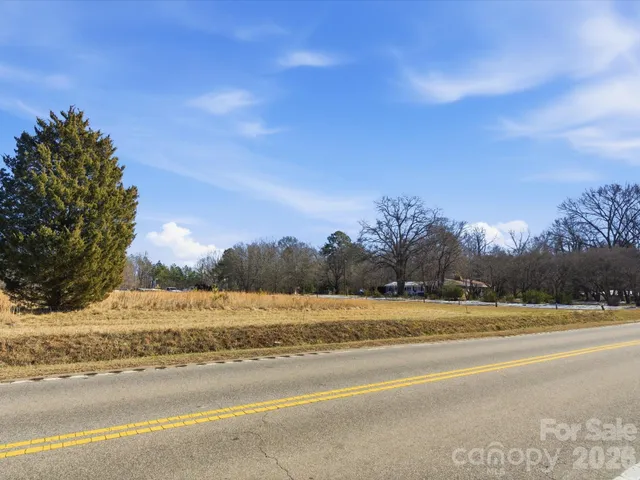 a view of lake with trees in the background