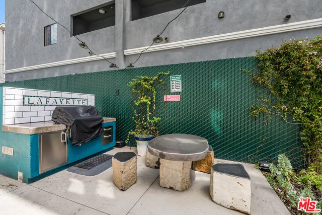 a view of outdoor seating area with potted plants