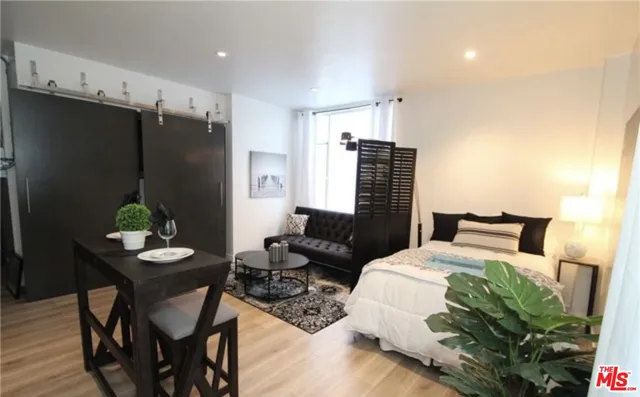 a bed room with bed and a table