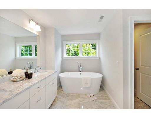 161 Peter Spring Road Concord, MA 01742 - Photo 15 of 17 a bathroom with a double vanity sink bathtub and window