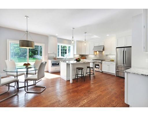 161 Peter Spring Road Concord, MA 01742 - Photo 8 of 17 a open kitchen with stainless steel appliances kitchen island granite countertop a dining table chairs and white cabinets
