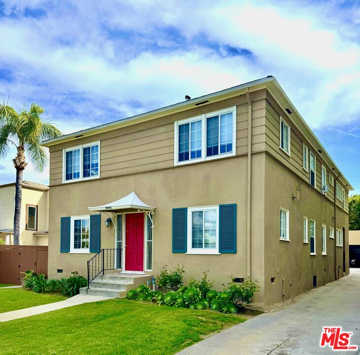 11926 West Magnolia Boulevard, Unit 1/4 Valley Village, CA 91607 - Photo 2 of 12 a front view of a house with garden