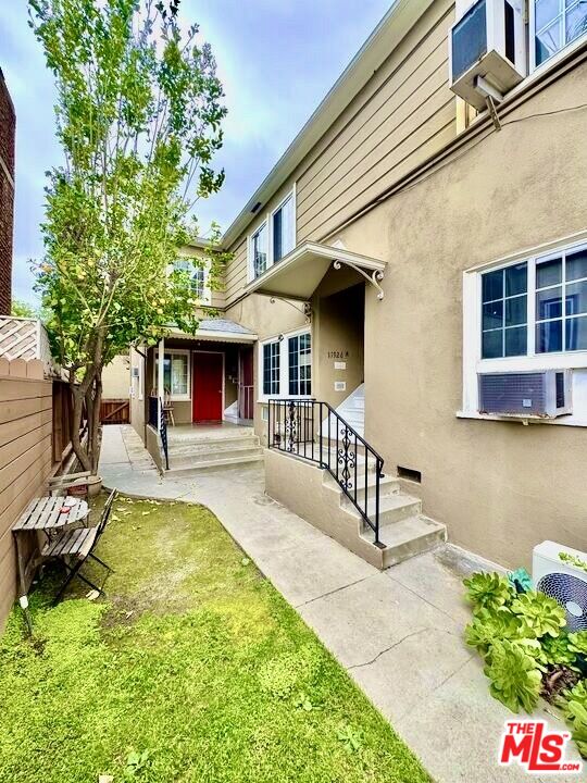 11926 West Magnolia Boulevard, Unit 1/4 Valley Village, CA 91607 - Photo 3 of 12 a view of a house with swimming pool and sitting area