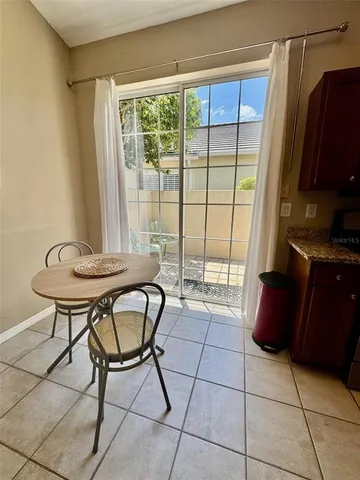 a view of a room with furniture and a window