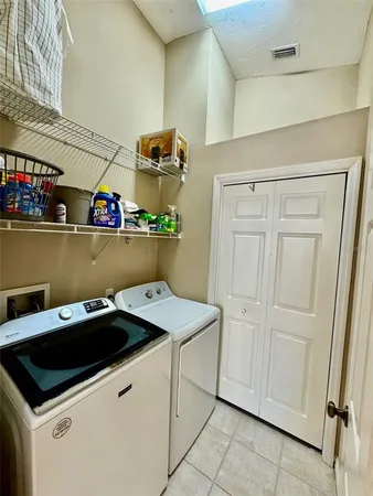 a utility room with dryer and washer